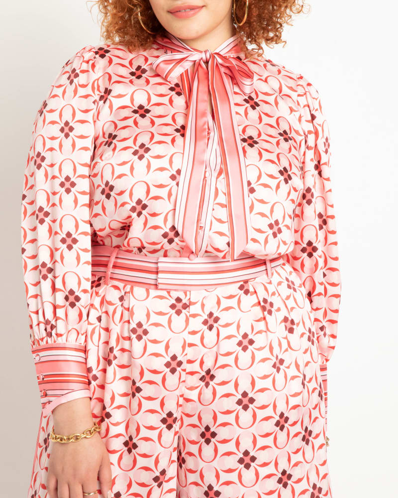 Front of a model wearing a size 14 Danielle Puff Sleeve Blouse in Rare As A Gem by ELOQUII. | dia_product_style_image_id:231473